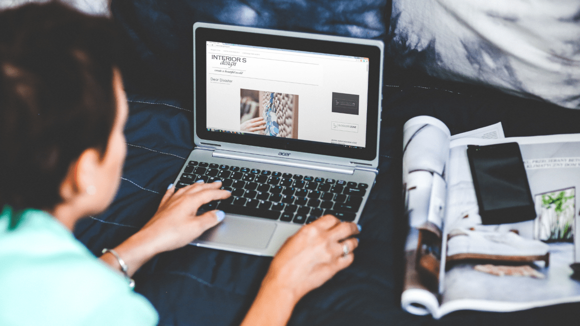 Woman browsing a blog on her laptop