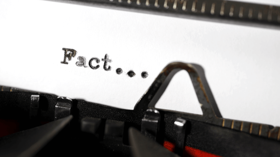 Close-up of the word 'Fact' written on a typewriter.